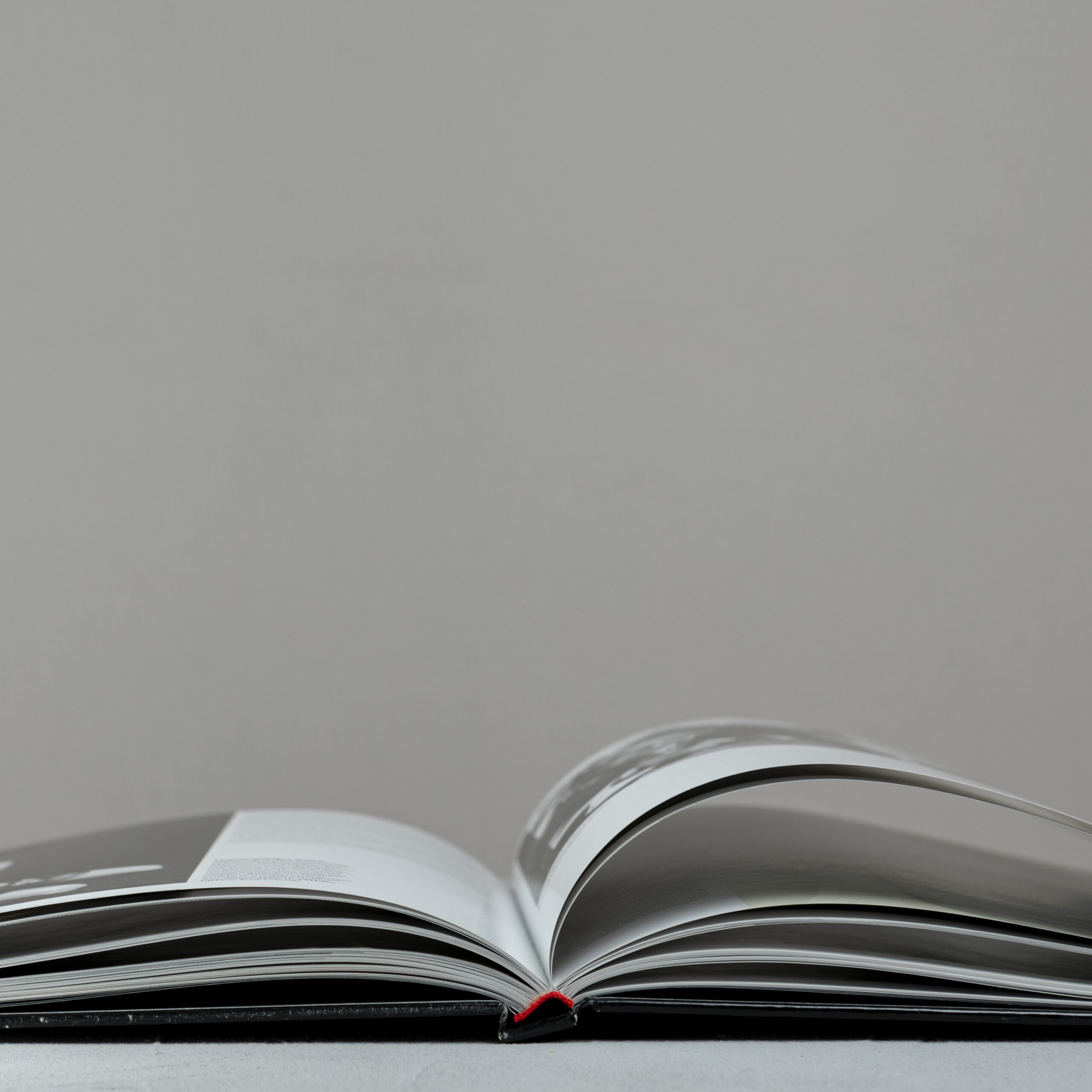 front-view-open-book-with-grey-background